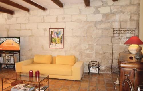 a living room with a couch and a table at 2 Bedroom Beautiful Home In Bellegarde in Bellegarde