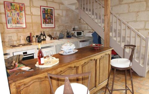 a kitchen with a table with a cake on it at 2 Bedroom Beautiful Home In Bellegarde in Bellegarde