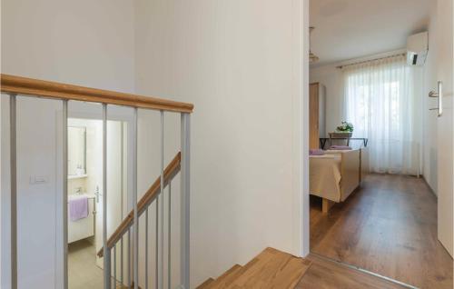 a room with a staircase and a living room at Four-Bedroom Holiday Home In Manjadvorci in Manjadvorci