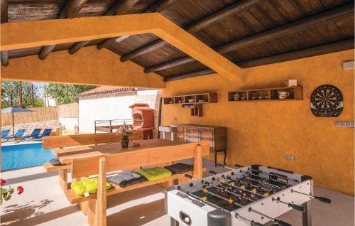 a kitchen with a stove and a swimming pool at Cozy Home In Barban With Wifi in Barban