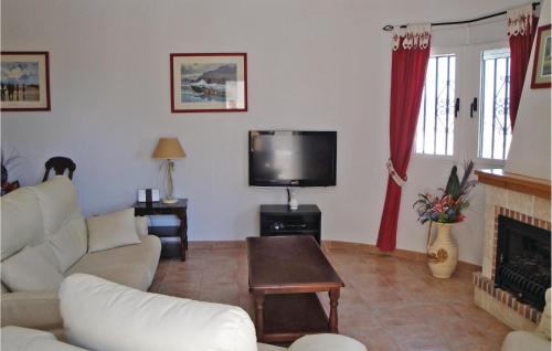 a living room with a couch and a tv at Gorgeous Home In Castalla With Wifi in Castalla
