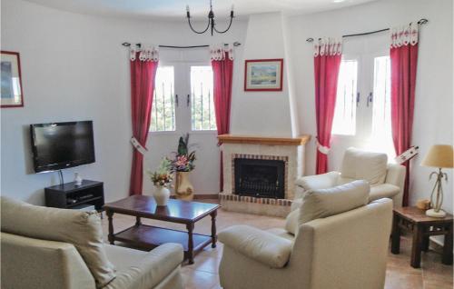 a living room with red curtains and a fireplace at Gorgeous Home In Castalla With Wifi in Castalla