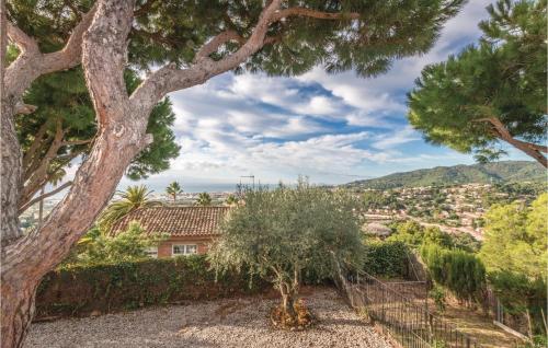 a view from the garden of a house with a tree at Amazing Home In Cabrils With Wifi in Cabrils