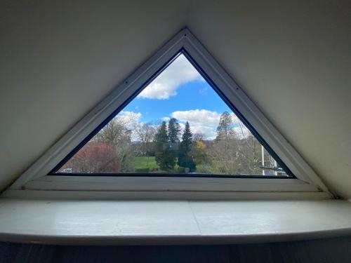 a window in the corner of a room at Autumn Leaves Guest House in Windermere