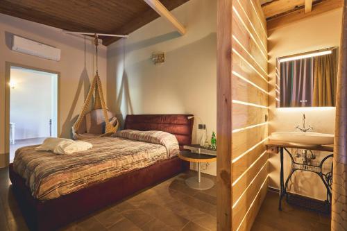 En eller flere senge i et værelse på Le Stagioni Luxury Suite