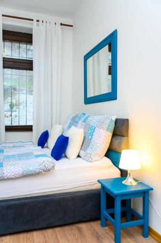 Llit o llits en una habitació de Dalmatinska Apartment