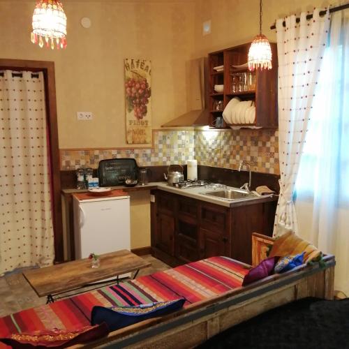 a kitchen with a sink and a counter top at Eco Moyano Posada in Gaucín