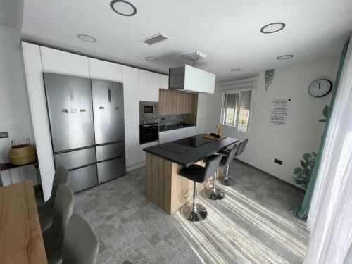 a kitchen with a black counter top in a room at MONTE AZUL in Málaga