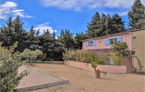a garden with a house and trees in the background at Amazing Home In Lançon De Provence in Lançon-Provence