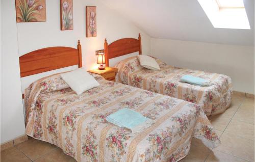 two beds sitting next to each other in a room at Awesome Apartment In Los Alczares With 5 Bedrooms And Wifi in Los Alcázares