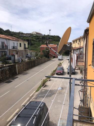 a satellite dish sitting on the side of a street at Soleli in Molino San Biagio