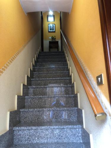 a flight of stairs in a building at Soleli in Molino San Biagio