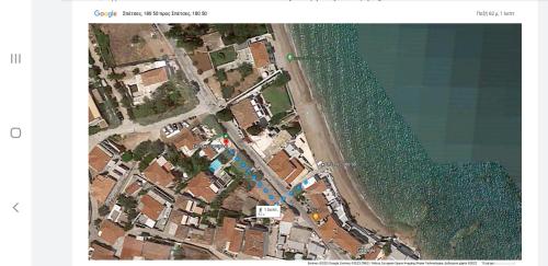 an overhead view of a beach and the water at Spetses House - Near Kaiki Beach in Spetses