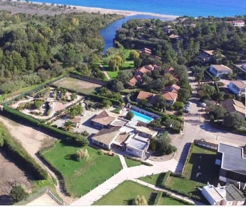 an aerial view of a house with a river at L'Original, Superbe appartement à 5min de la plage in Zonza