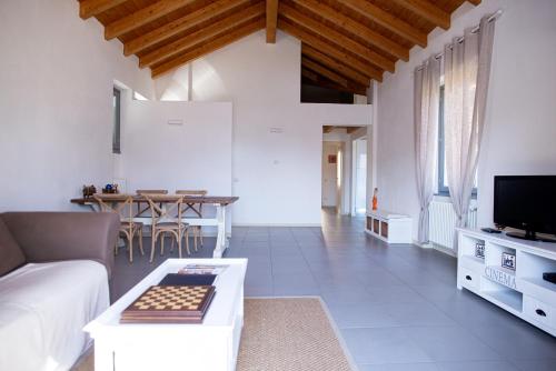 a living room with a couch and a table at Griante suites in Griante Cadenabbia