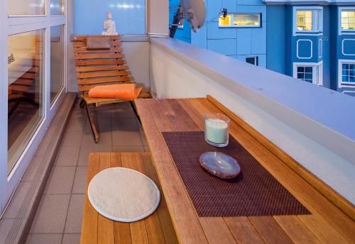 a coffee table with a plate and a candle on it at CitySuite Lienz in Lienz