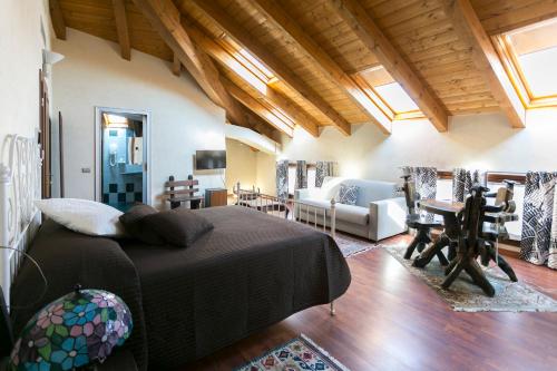a bedroom with a bed and a living room at Camere Da Kico in Assago