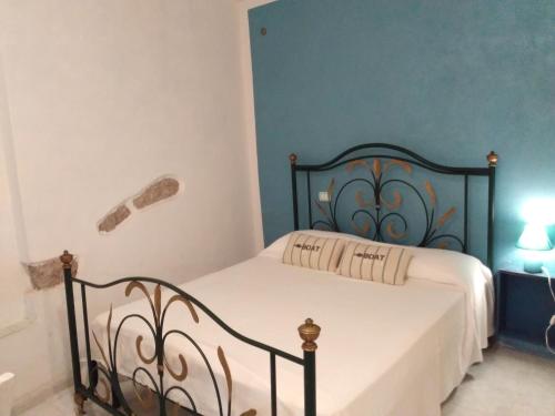Łóżko lub łóżka w pokoju w obiekcie Carruggetto