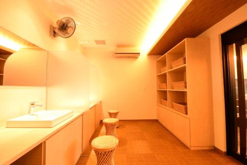 a bathroom with a sink and two stools at 高野山 宿坊 龍泉院 -Koyasan Shukubo Ryusenin- in Koyasan
