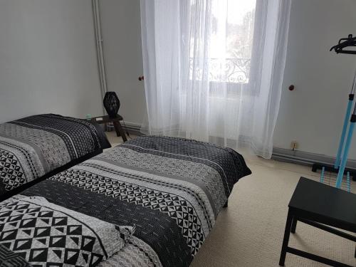 Cama ou camas em um quarto em Résidence de Suzanne Gîte avec sauna privatif