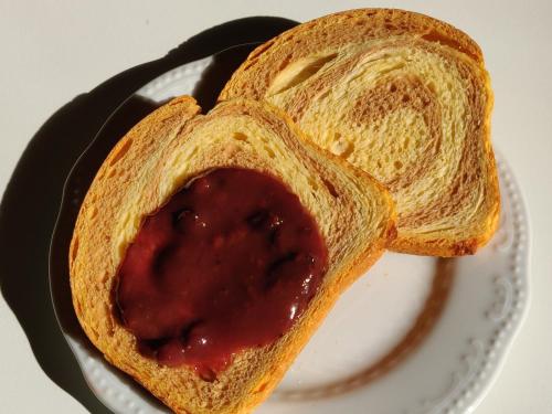 a piece of bread with jelly on a plate at Palazzo Muro Leccese Relais de Charme & Wellness in Muro Leccese