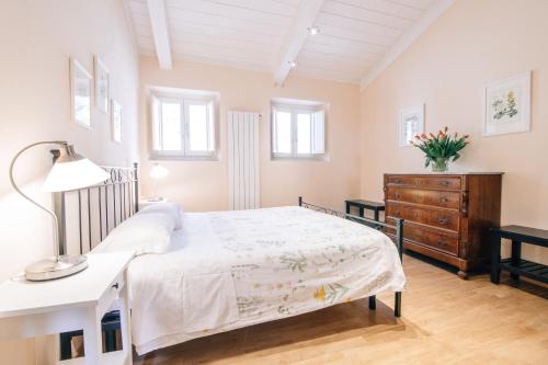 Ένα ή περισσότερα κρεβάτια σε δωμάτιο στο Holiday Home Il Borgo Degli Agrumi