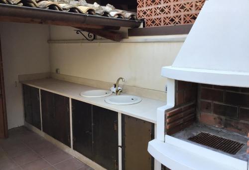 a bathroom with two sinks in a room at Casa Romano - Marina di Modica in Marina di Modica