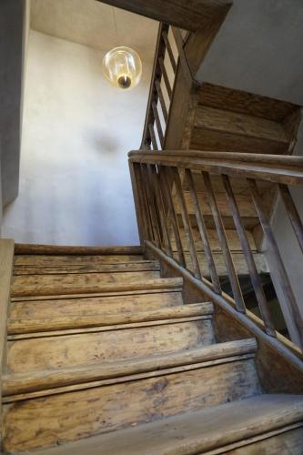 a set of stairs in a house with a light at Modiste in Kuldīga