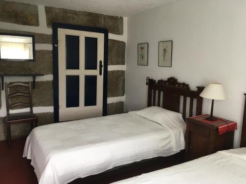 Katil atau katil-katil dalam bilik di Casa em Resende com Vista Para o Rio Douro
