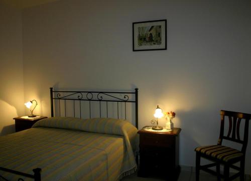 Un pat sau paturi într-o cameră la Case Vacanze Valle