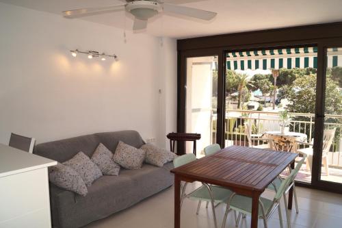 a living room with a couch and a table at BEACH PARADISE in Cambrils