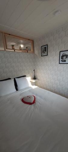 מיטה או מיטות בחדר ב-Gîte le Quesnoy
