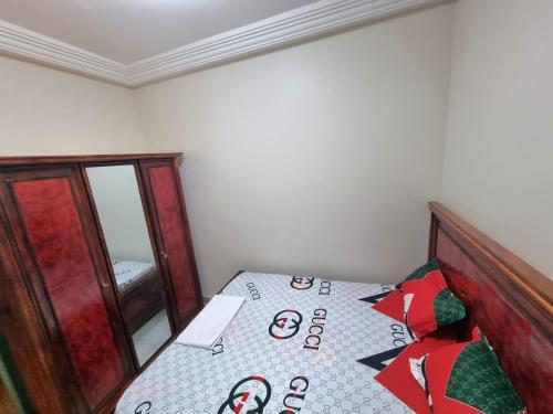 Кровать или кровати в номере SUPERBE APPARTEMENT MEUBLÉ AU BORD DE LA PLAGE