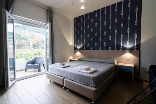 Säng eller sängar i ett rum på Riviera dei Tramonti