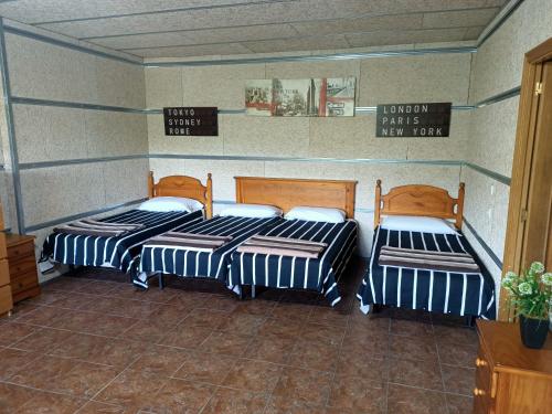 Ένα ή περισσότερα κρεβάτια σε δωμάτιο στο Villa Galicia