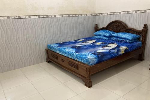 Postel nebo postele na pokoji v ubytování OYO Homes 91136 Desa Wisata Dalegan