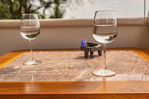 two glasses of white wine sitting on a table at La Hacienda Tilantongo in Puerto Escondido