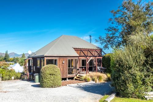 a small cabin with a gambrel roof at 7b Denby Place in Hanmer Springs