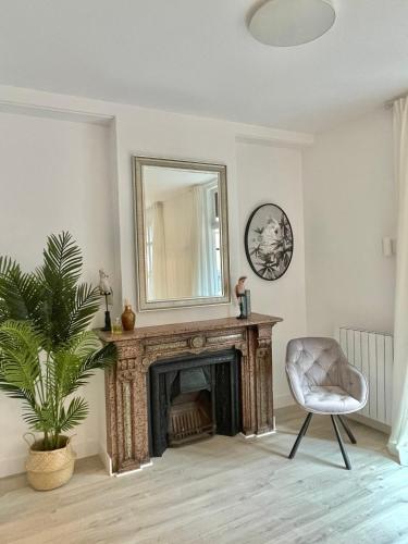 a living room with a fireplace and a mirror at Bilbao Azkuna Home Centro EBI01832 in Bilbao