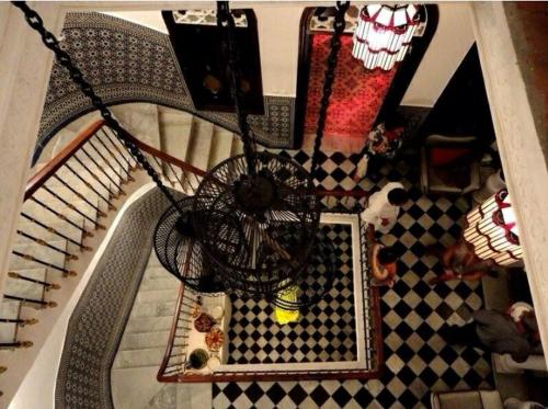 an overhead view of a staircase with a chandelier at SUMMER HOUSE TANGER in Tangier