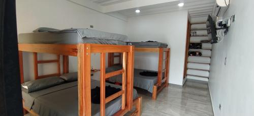 a room with bunk beds in a room with at Hotel Magic Capurganá in Capurganá