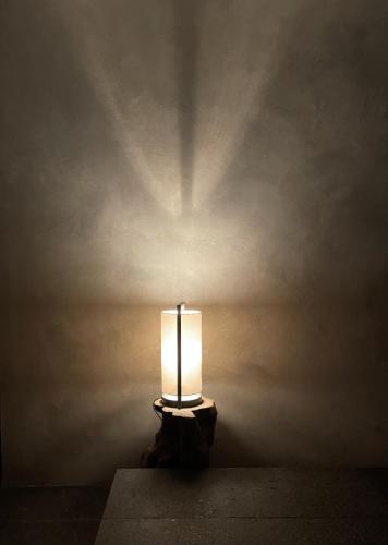 a lit lamp sitting on a table in a room at Lombok Private Villa Estate in Ketapang