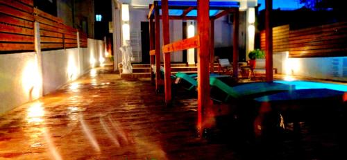 a room with a table and a swimming pool at Villa Athina 1st floor in Nea Kallikrateia