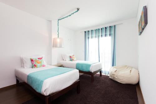 Ένα ή περισσότερα κρεβάτια σε δωμάτιο στο D Wan Deluxe Apartments