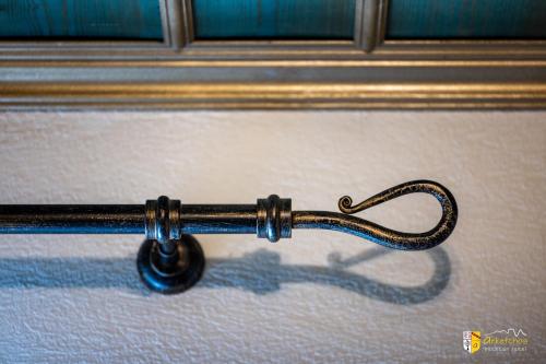 a close up of a door handle on a window at Arkefthos Mountain Hotel in Papigko