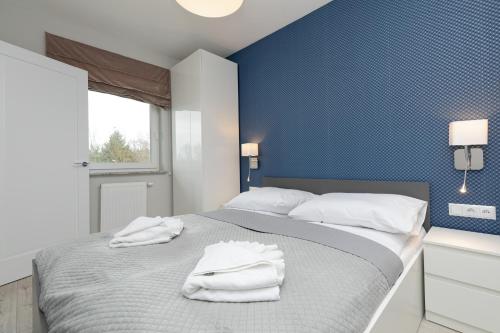 เตียงในห้องที่ Jantar Apartamenty - Porta Mare