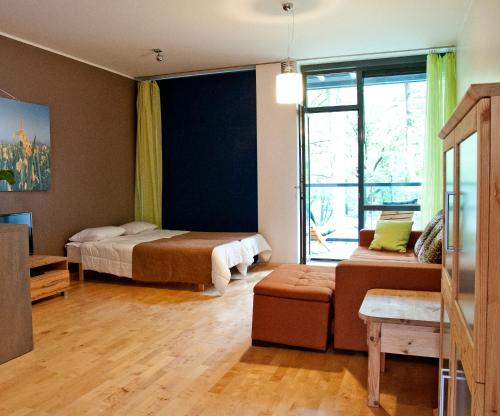 Кровать или кровати в номере Jalaka Apartment with sauna