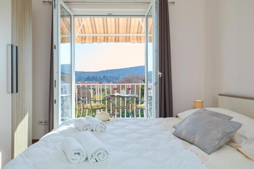 Posteľ alebo postele v izbe v ubytovaní Apartment Marijana