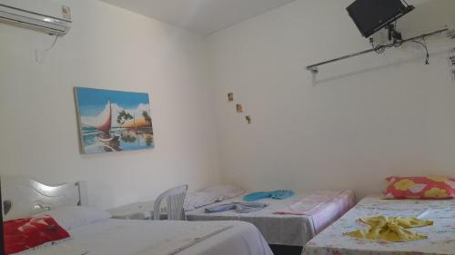 Una cama o camas en una habitación de Pousada Subindo as Dunas