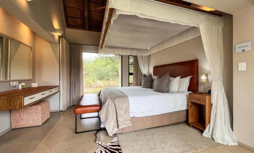 Voodi või voodid majutusasutuse Jacana River Lodge Mjejane Game Reserve toas